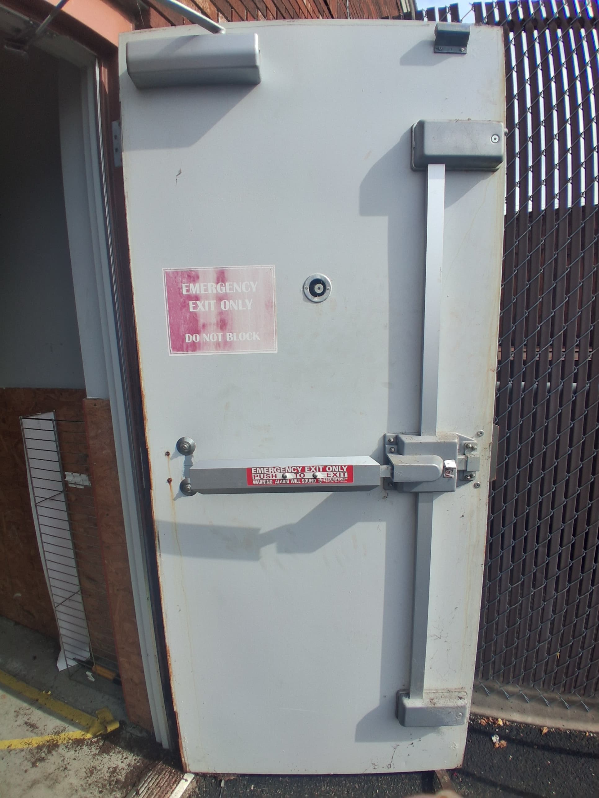 Replaced commercial exterior door with exit hardware