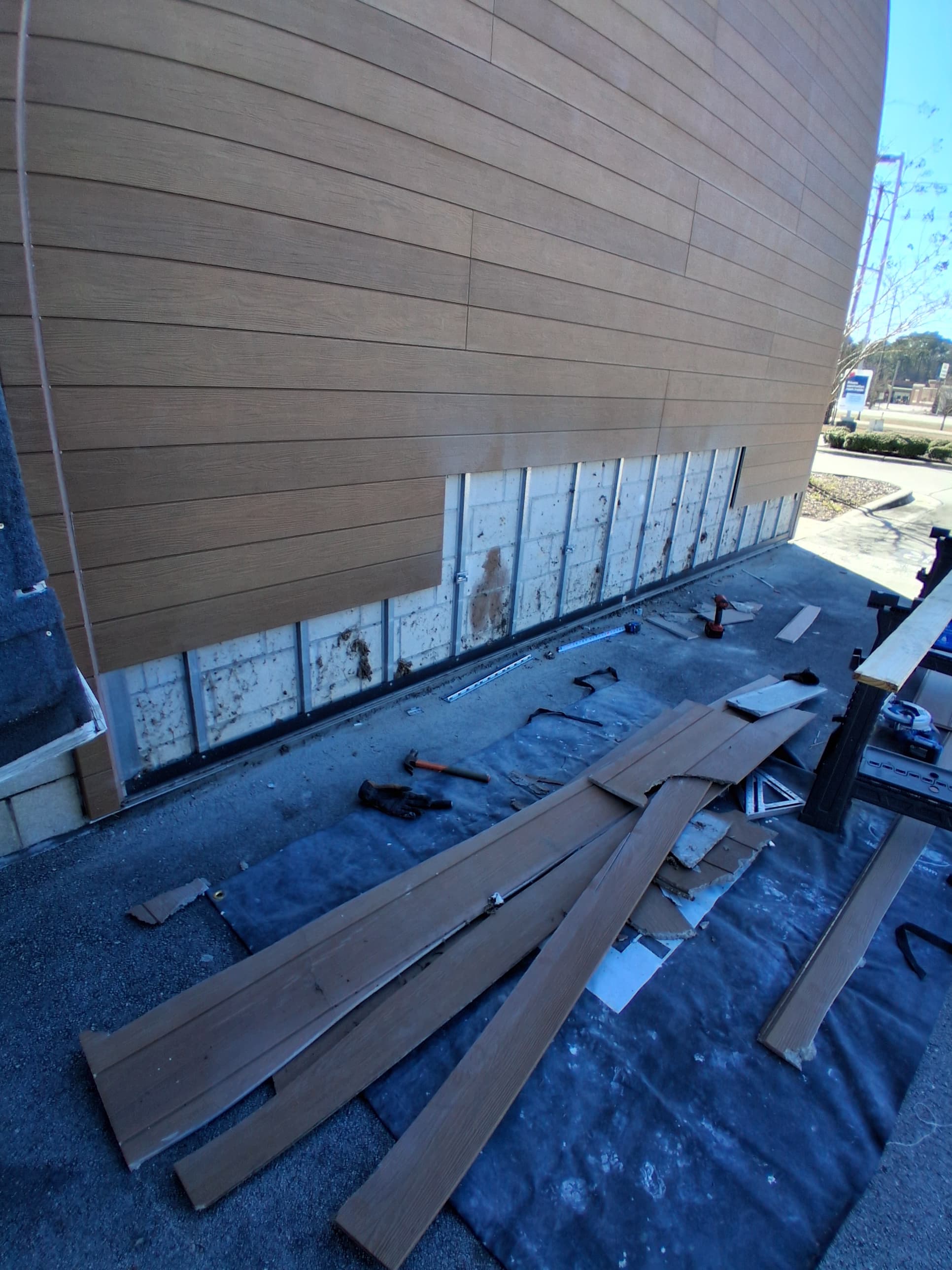 Commercial exterior siding before repair