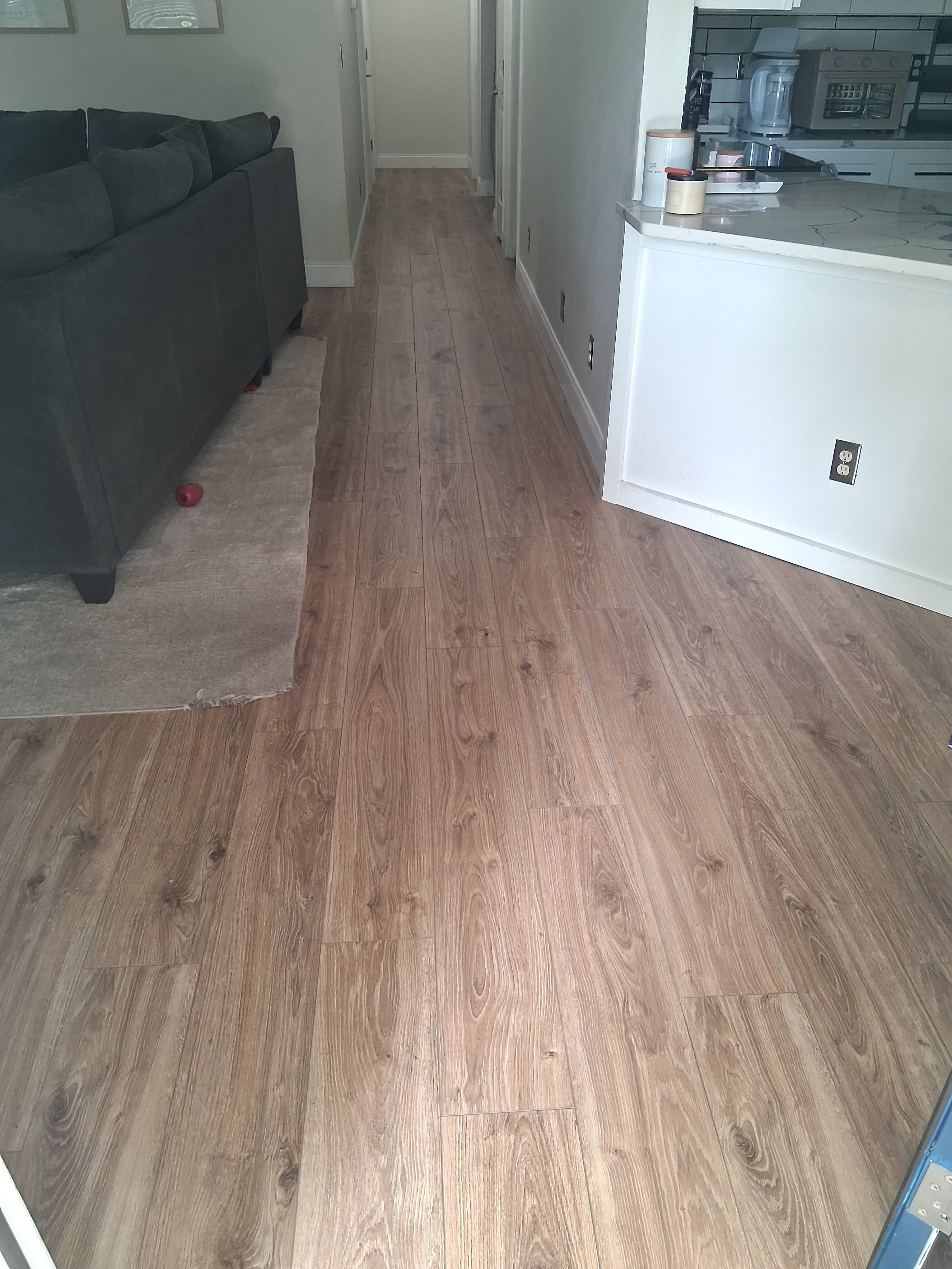 Completed residential luxury vinyl plank flooring repair